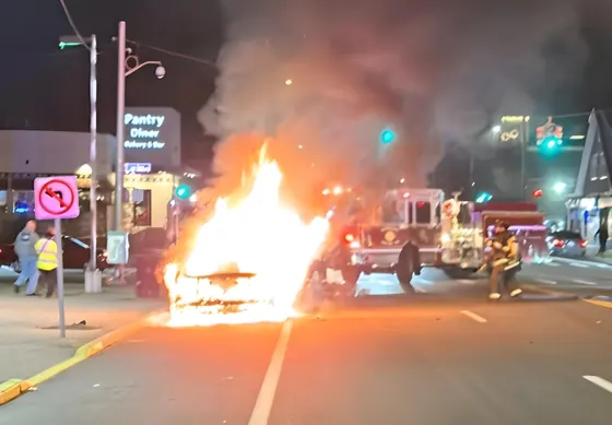 Woodland apparatus operating at a nighttime vehicle fire